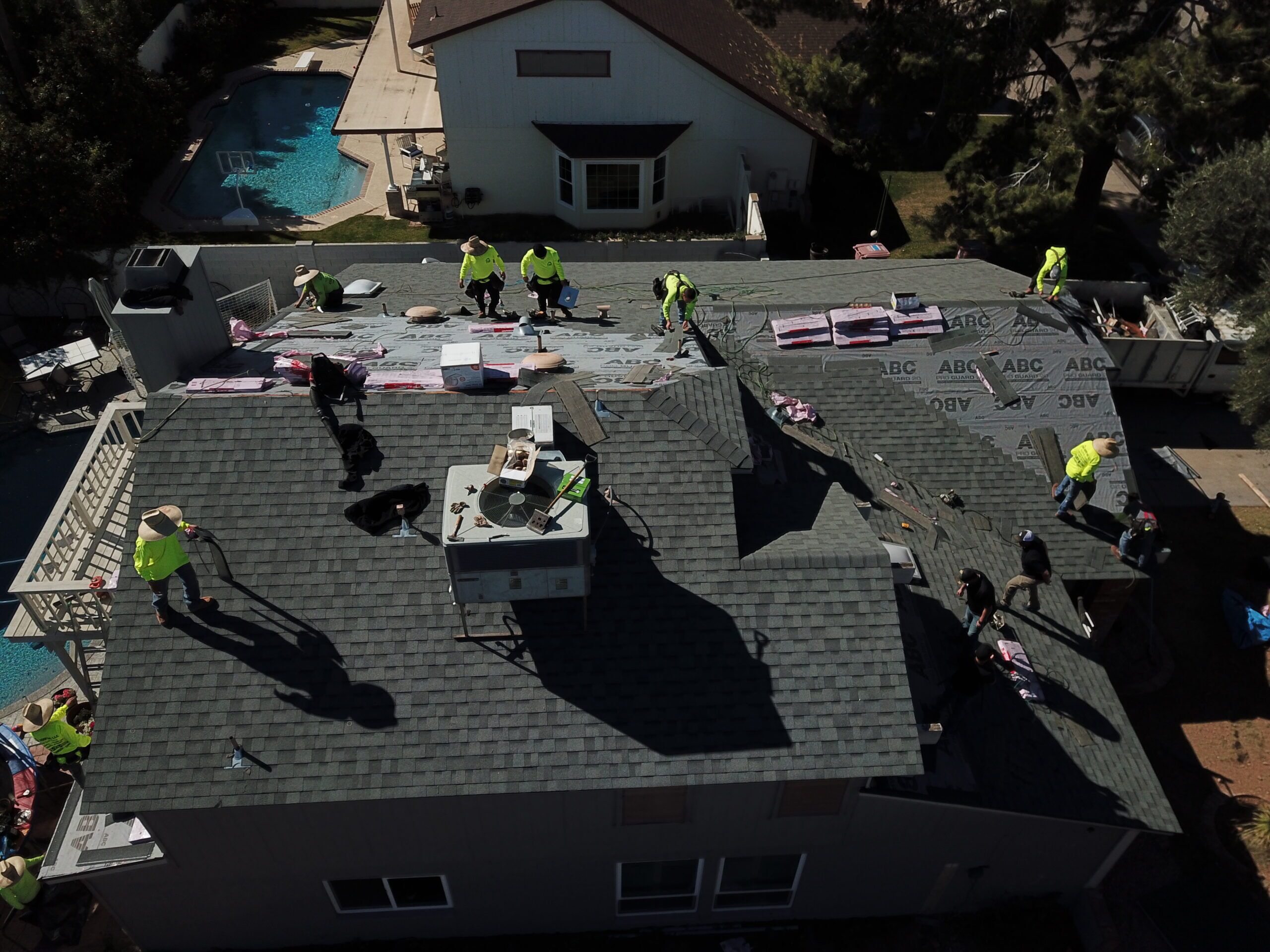 Phoenix tile roof under inspection — detailed tile and solar panel view