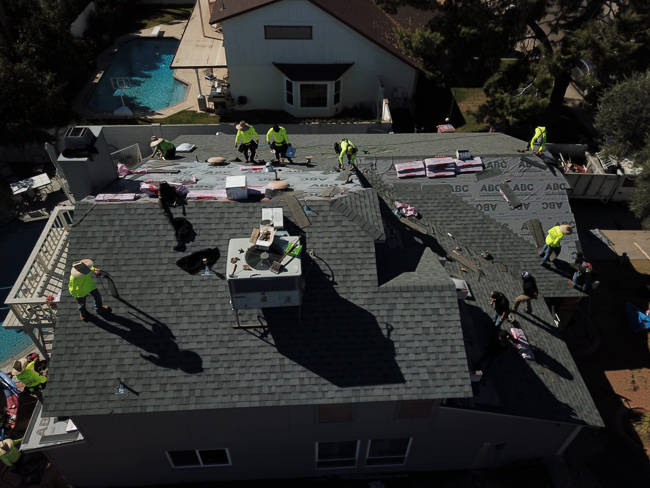 Phoenix tile roof under inspection — detailed tile and solar panel view