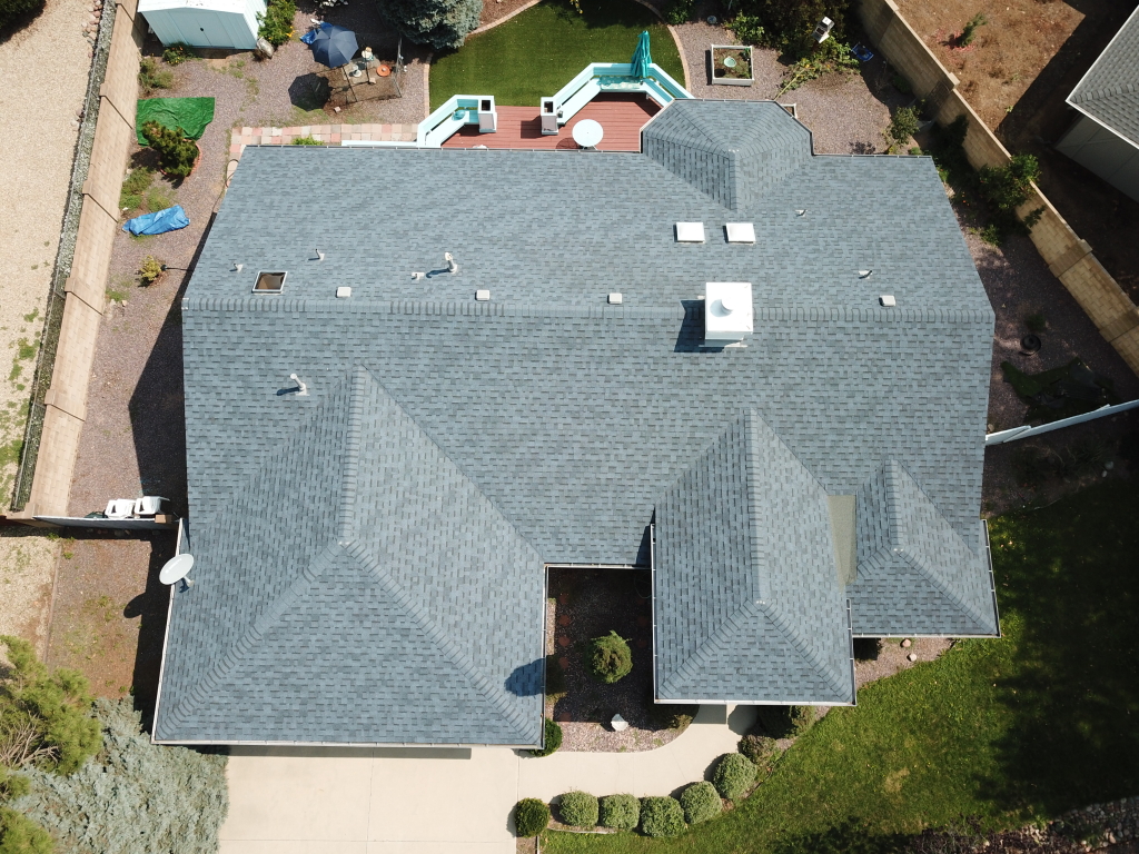 a house with a pool and a lawn
